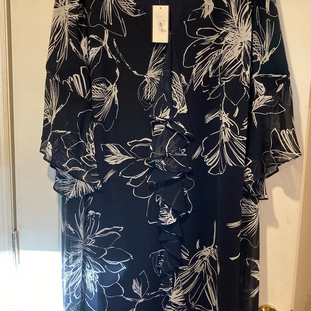 Dress with ruffle front and flare sleeves